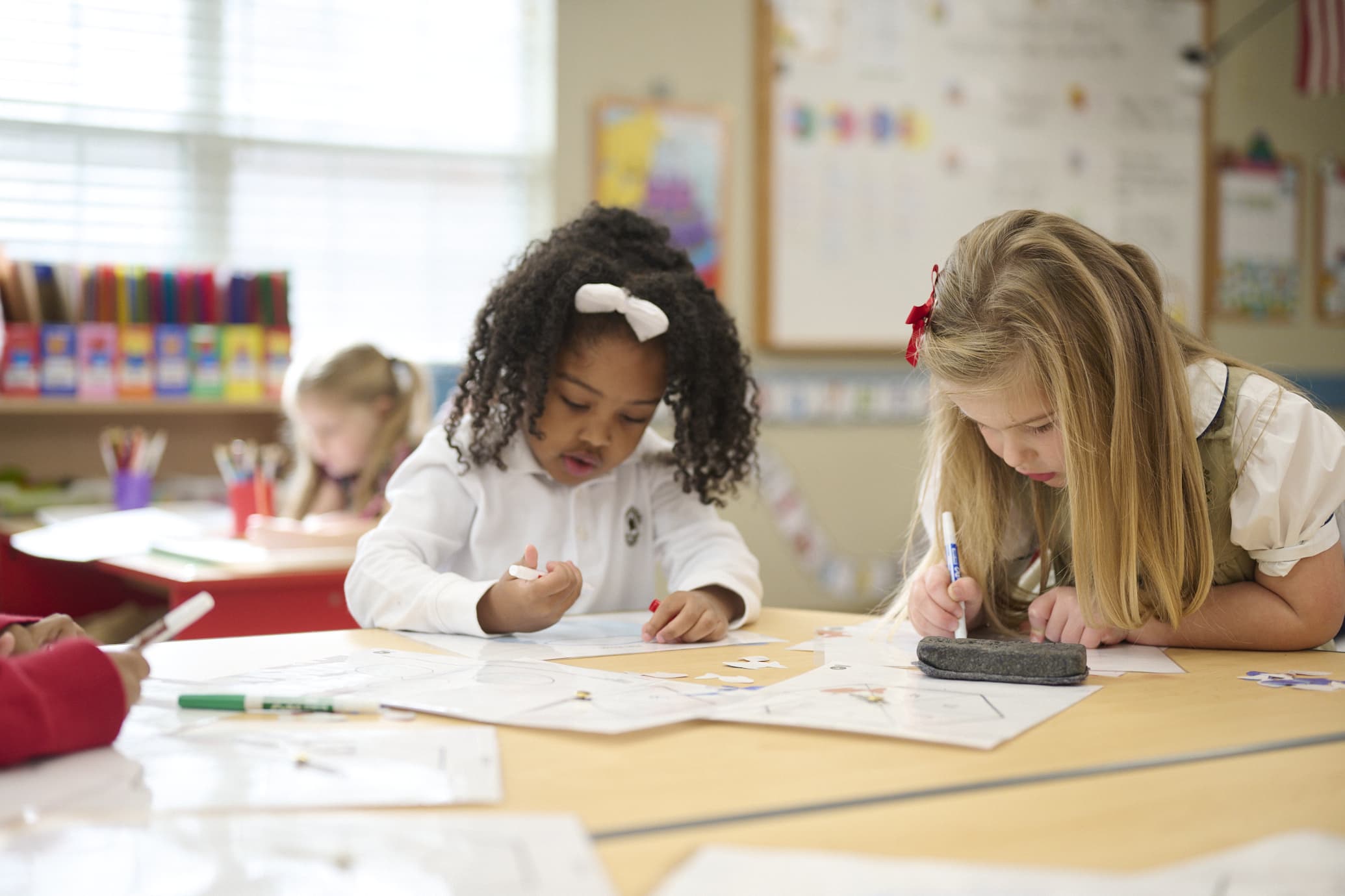 kindergarten students completing classwork