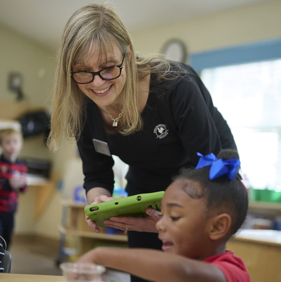 teacher speaking with child